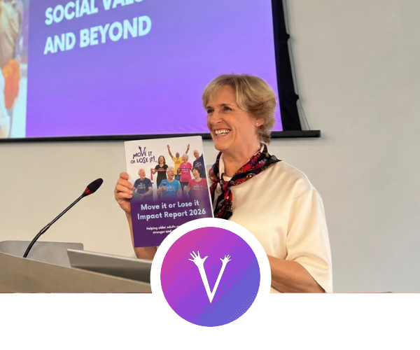 CEO Julie Robinson holding a copy of the Move it or Lose it Impact report 2026