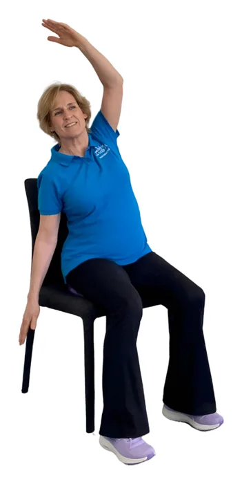 Move it or Lose it instructor demonstrating the side lean wobble cushion exercise on a chair